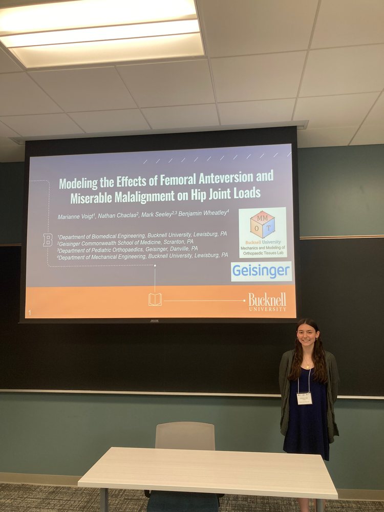 A student presenting her research at a conference
