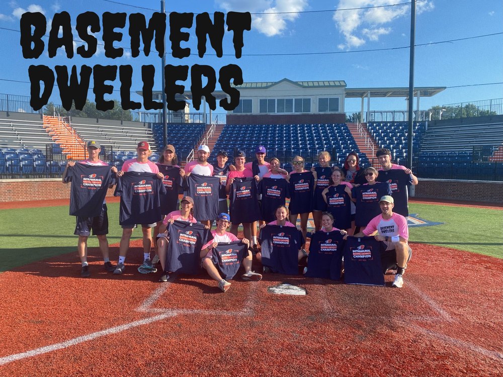 The lab's summer softball team holding intramural champion shirts